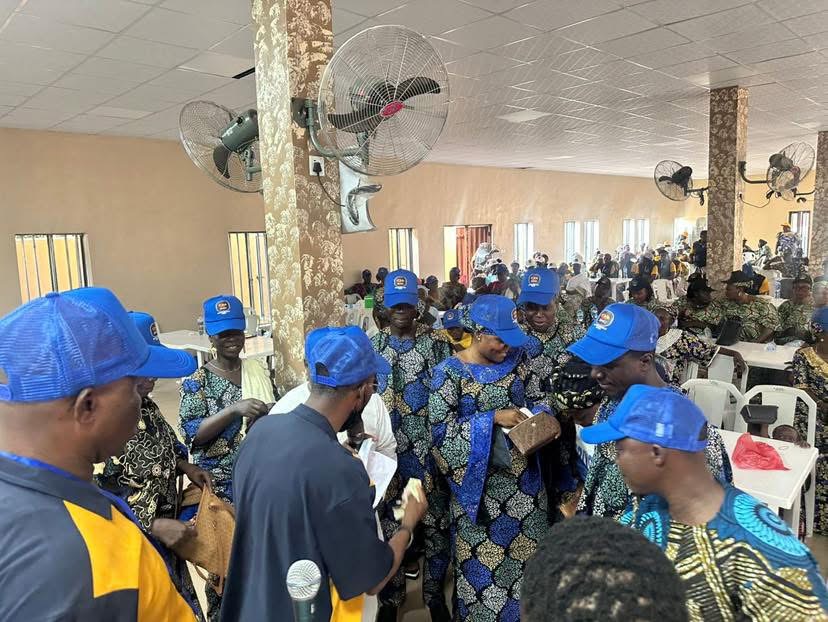 IMC members in matching cooperative attire at a meeting hall
